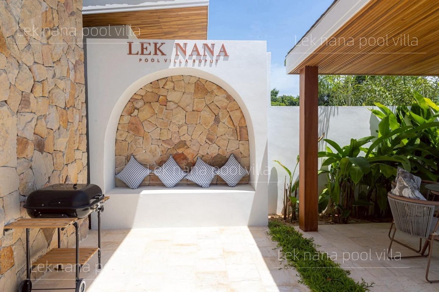 Lek Nana Bophut Phase 2 — stone arch seating area in the garden