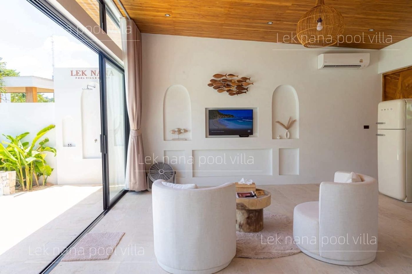Lek Nana Bophut Phase 2 — living room with a view of the pool